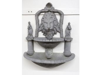 A Cast Metal Lion's Head Double Well Exterior Fountain
