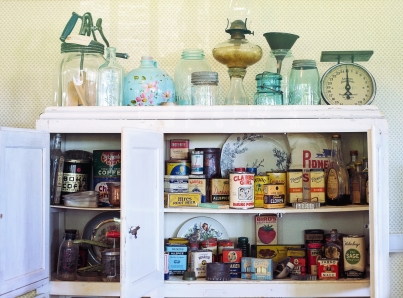 Vintage kitchenware in cabinet