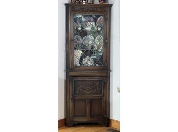 JACOBEAN STYLE CARVED OAK CORNER CUPBOARD