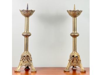 PAIR OF CAST BRASS GOTHIC STYLE CANDLE HOLDERS