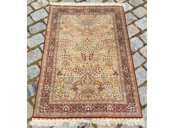 SIGNED SILK ORIENTAL AREA RUG.