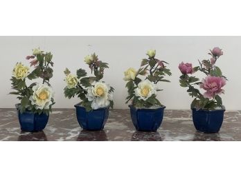 (4) SMALL POTTED FLOWER ARRANGEMENTS