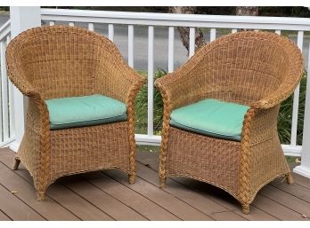 PAIR OF WICKER ARM CHAIRS WITH CUSHIONS