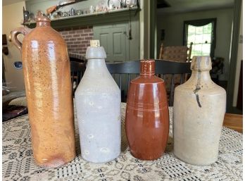 (4) VINTAGE STONEWARE JUGS