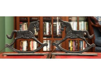 PAIR OF ROCKING HORSE-FORM CAST IRON DOORSTOPS