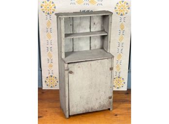 DIMINUTIVE PRIMITIVE PINE CUPBOARD IN OLD PAINT