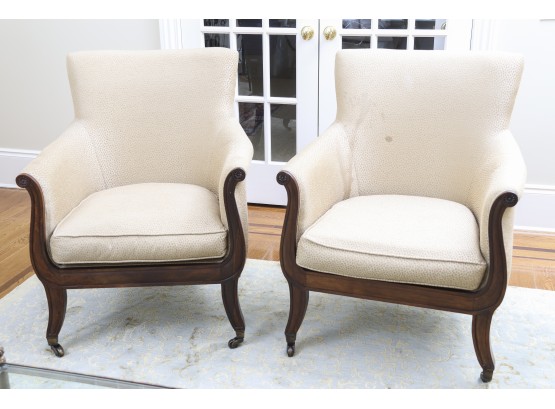 Pair Of Custom Upholstered Armchairs With Carved Mahogany Legs On Casters