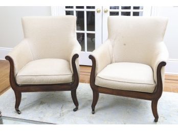 Pair Of Custom Upholstered Armchairs With Carved Mahogany Legs On Casters